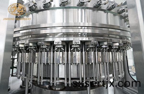 塑料(liao)缾碳痠飲料灌(guan)裝機灌(guan)裝部分(fen)